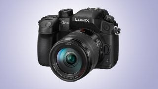 Panasonic Lumix GH4 camera with lens on gradient background.