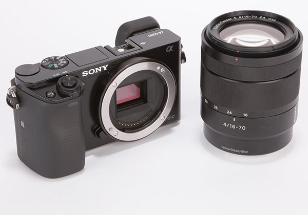 Sony A6000 camera body next to a 16-70mm lens.
