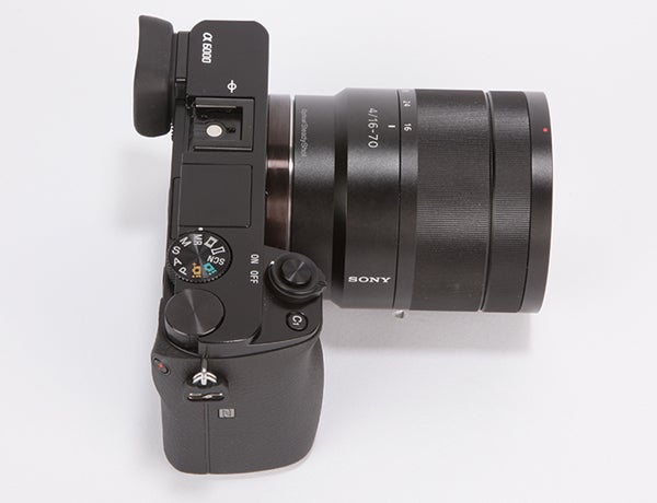 Sony A6000 camera with lens and flash attachment.