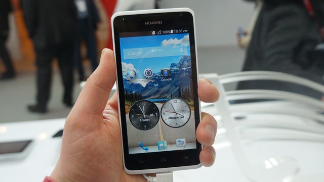 Hand holding a Huawei Ascend Y530 smartphone.