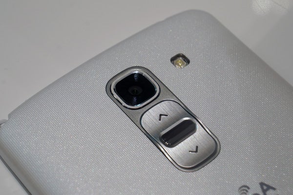 Hand holding LG G Pro 2 smartphone with screen off.Close-up of LG G Pro 2 smartphone camera and volume buttons.