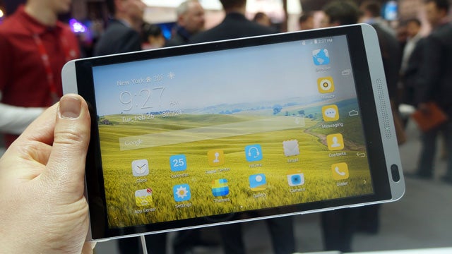 Huawei MediaPad M1 tablet held in hand on display
