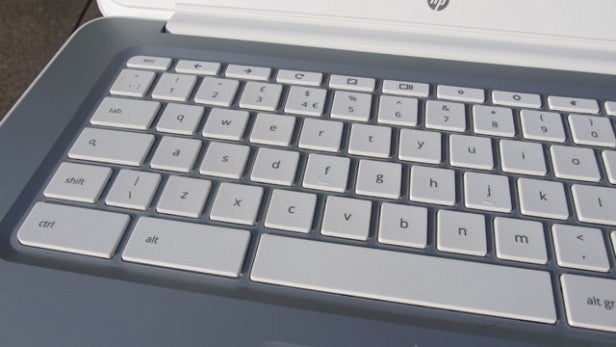 Close-up of a laptop keyboard and partial trackpad.