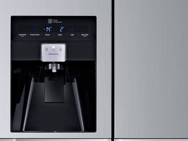 Close-up of LG GSL545NSYV fridge water and ice dispenser.