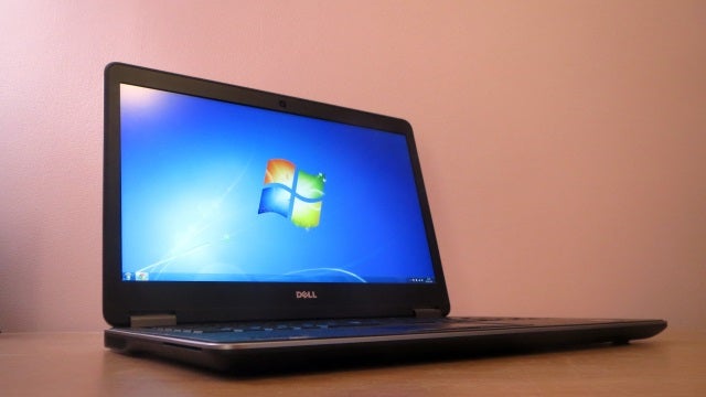 Dell Latitude E7440 laptop with Windows on screen.