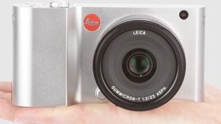Leica T digital camera held in a person's hand