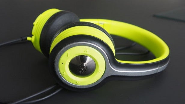 Monster iSport Freedom wireless headphones on black surface.