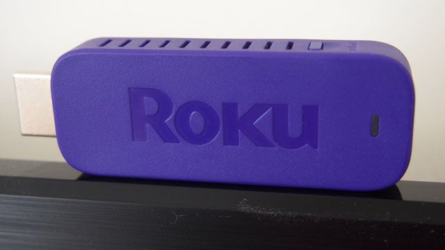 Roku Streaming Stick plugged into a TV's HDMI port.