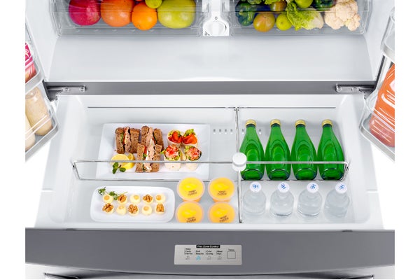 Samsung RF24FSEDBSR fridge interior with food items organized inside.