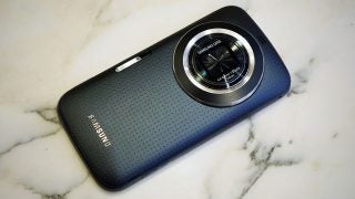 Samsung Galaxy K Zoom smartphone with camera lens on marble surface