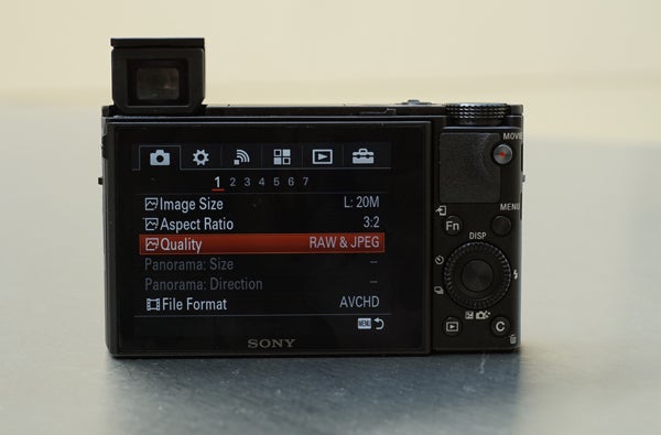 Sony RX100 III camera with screen displaying settings options.