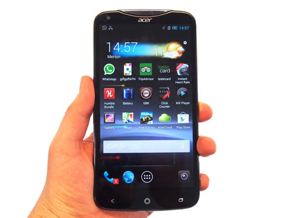 Hand holding an Acer Liquid S2 smartphone displaying apps.Close-up of Acer Liquid S2 smartphone's bottom screen with soft keys.