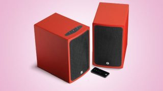 Q Acoustics Q-BT3 speakers in red with remote control.