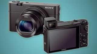 Sony RX100 III camera with viewfinder extended and screen displayed.