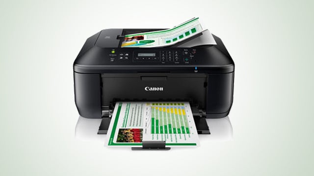 Canon PIXMA MX475 printer with printed color graphs.
