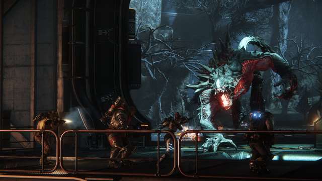 Screenshot of Evolve game showing monster and hunters in combat.