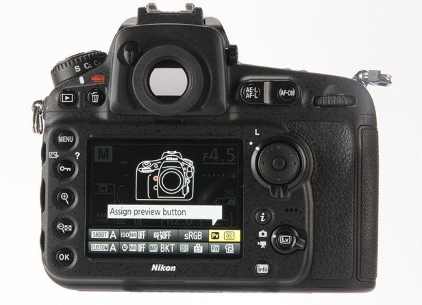 Nikon D810 DSLR camera rear view showing LCD screen and buttons.