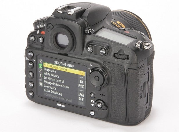 DSLR camera showing shooting menu on LCD screen.