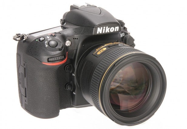 Nikon D810 DSLR camera with lens on white background.