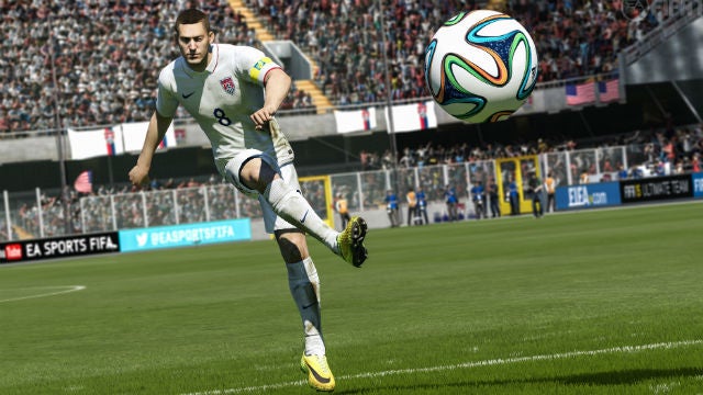 Player kicking ball in FIFA 15 video game screenshot.