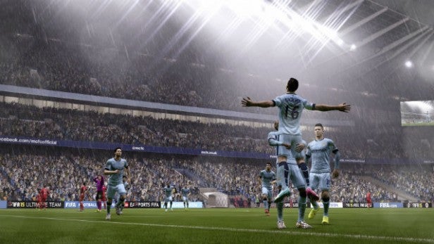In-game screenshot of FIFA 15 with players celebrating a goal.