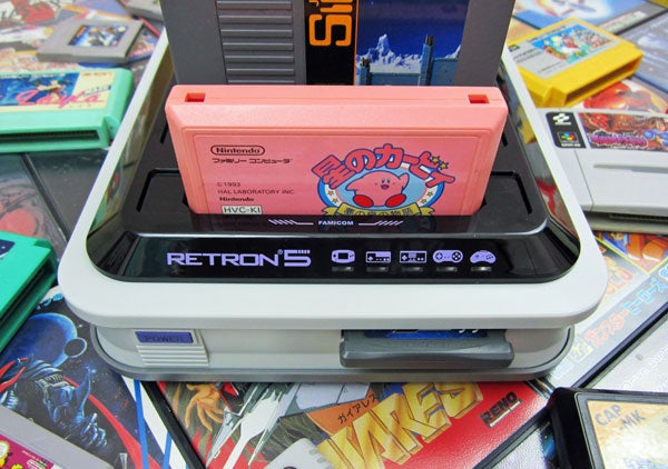 RetroN 5 console with a game cartridge inserted.