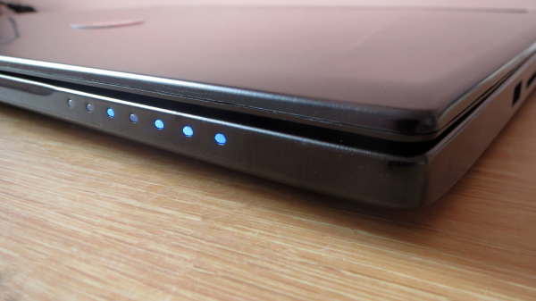 Close-up of MSI GS60 laptop's side showing ports and indicators.