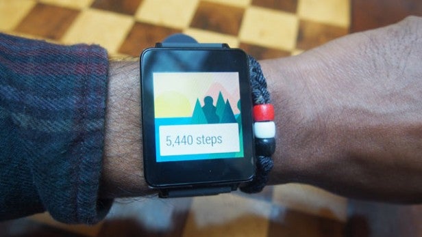 Smartwatch displaying step count on wearer's wrist.
