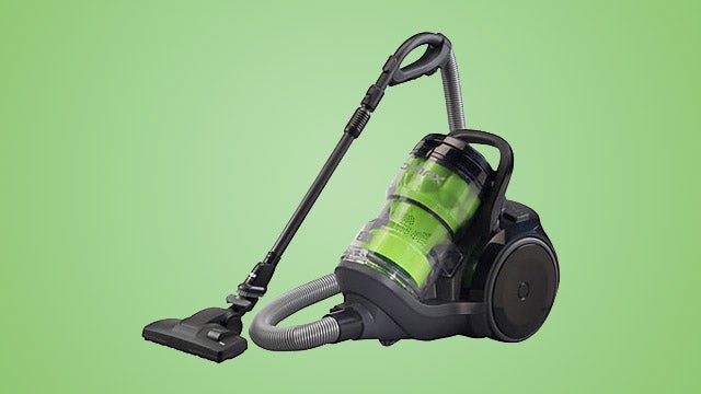 Panasonic MC-CL934 canister vacuum cleaner on green background.