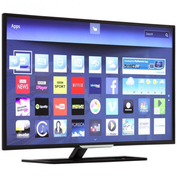 Philips 40PFT5509 TV displaying smart apps on screen.