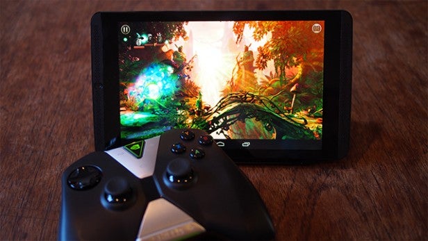 Tablet displaying game graphics with a gaming controller in front.