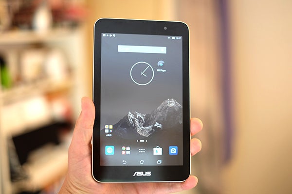 Asus Memo Pad 7 held in hand with screen on.