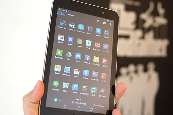 Hand holding Asus Memo Pad 7 displaying apps on screen