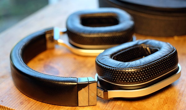 Oppo PM-1 headphones on a wooden surface.