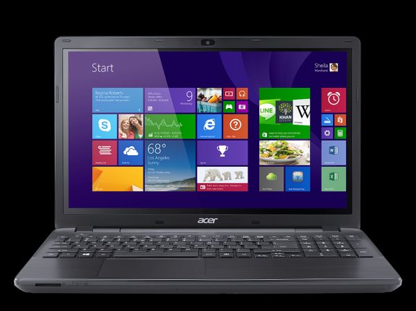 Acer Aspire E5-551 laptop with Windows Start screen displayed.