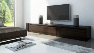 Philips Fidelio E5 speakers in modern living room setting.