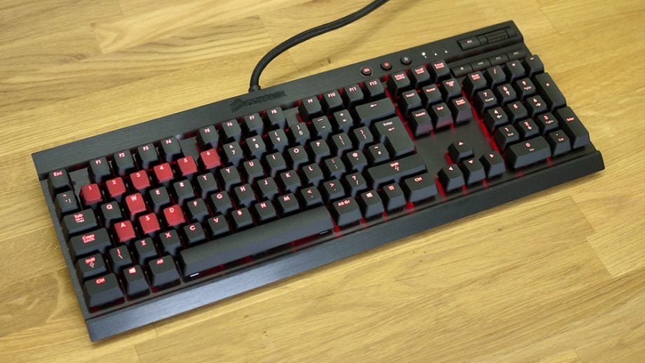 Corsair Vengeance K70 mechanical keyboard with red backlighting.