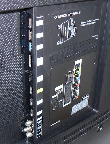 Back panel connectivity ports of Samsung UE55HU8200 TV.