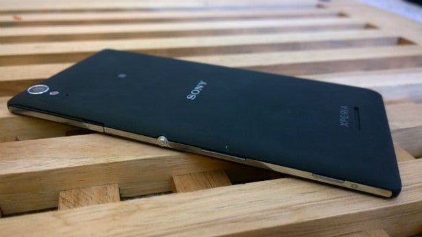 Sony Xperia T3 smartphone on wooden surface.