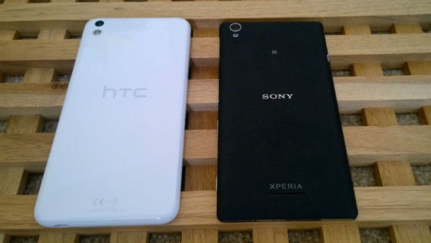 Sony Xperia T3 next to HTC phone on wooden surface.