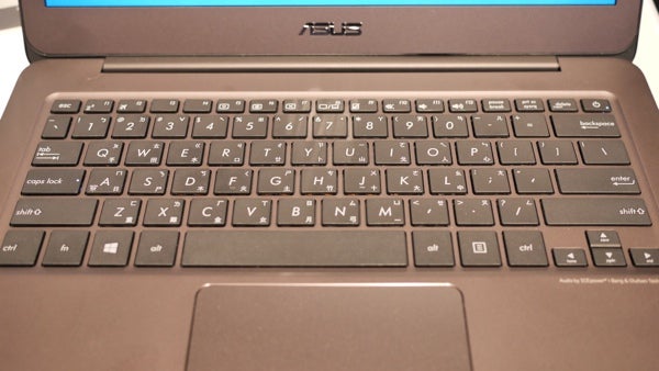 Asus ZenBook X305 laptop keyboard and touchpad close-up.