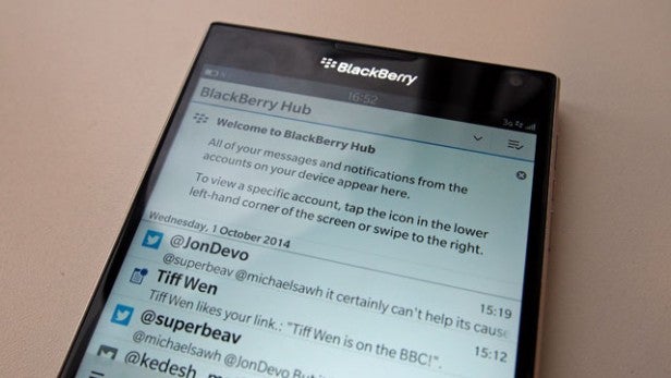 Smartphone displaying BlackBerry Hub with social media notifications.