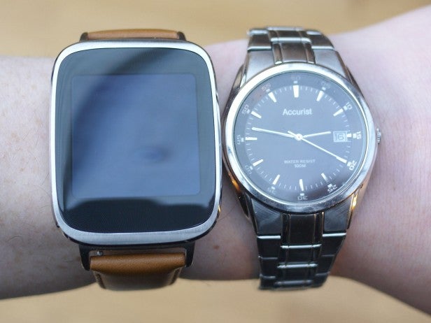 Smartwatch and traditional watch on a wrist.