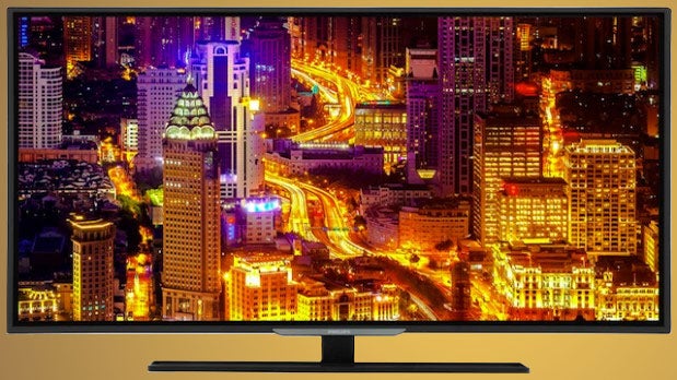 Philips 48PFT5509 television displaying a vibrant cityscape at night.