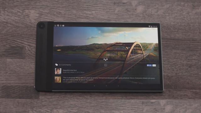 Dell Venue 8 7000 tablet displaying colorful landscape on screen.
