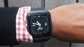 Sony SmartWatch 3 on wrist with analog watch face display