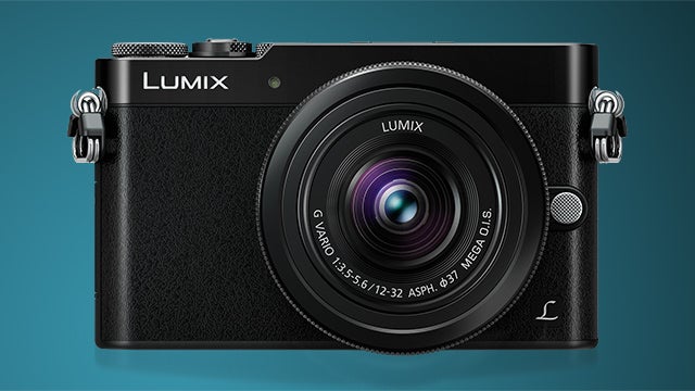 Panasonic Lumix DMC-GM5 camera on blue background.