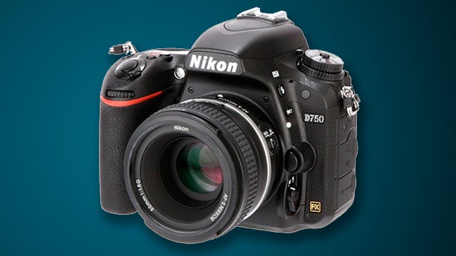 Nikon D750 DSLR camera with lens on a blue background.