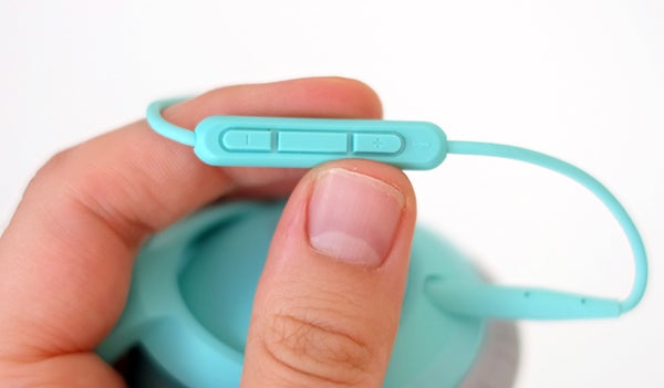 Close-up of Bose SoundTrue headphone controls in hand