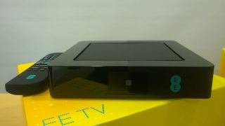 EE TV box and remote on a yellow stand